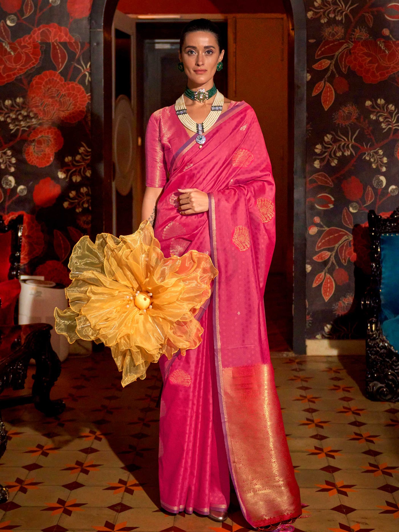 Purple–Rose Gold banarasi satin silk saree with rich woven zari work and golden pallu styled for weddings. Model in Purple–Rose Gold silk saree featuring temple-inspired zari buta and traditional border..