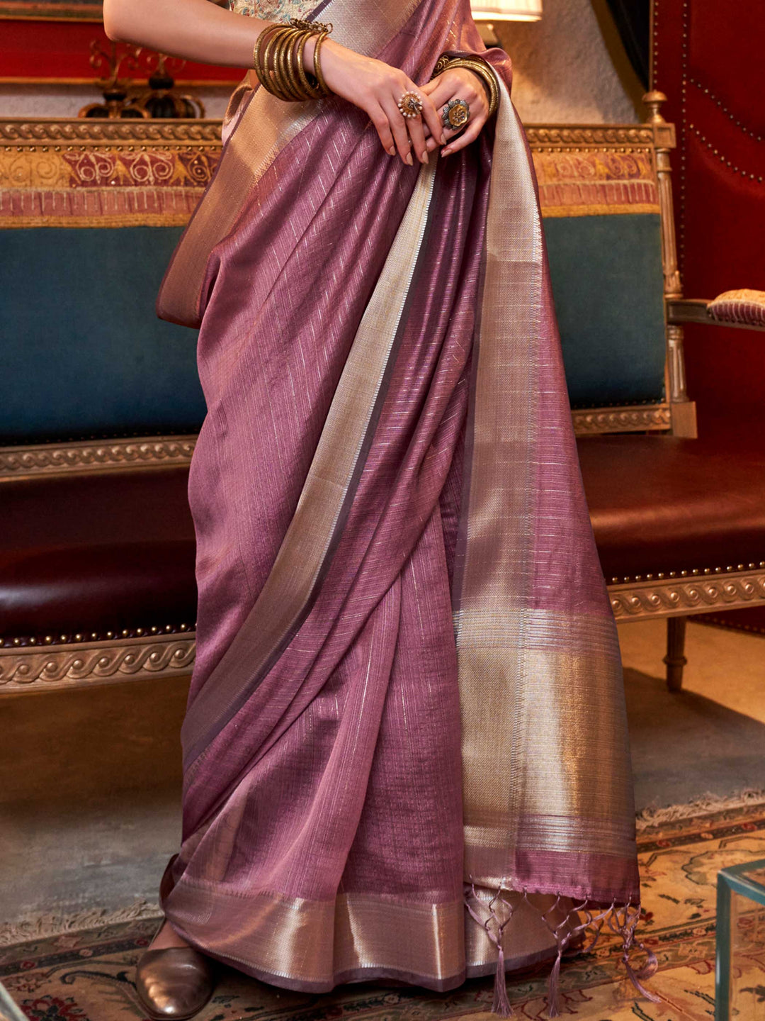 Soft Mauve chiffon saree with Champagne pallu and zari accents This image captures the back drape focus revealing pallu finesse and motif richness, ideal for visualizing festive elegance, designer appeal, and modern styling inspiration. Perfect for online shoppers seeking detailed previews before purchase, enhancing saree visual merchandising and SEO-rich product display strategy.                                                                                                                                 