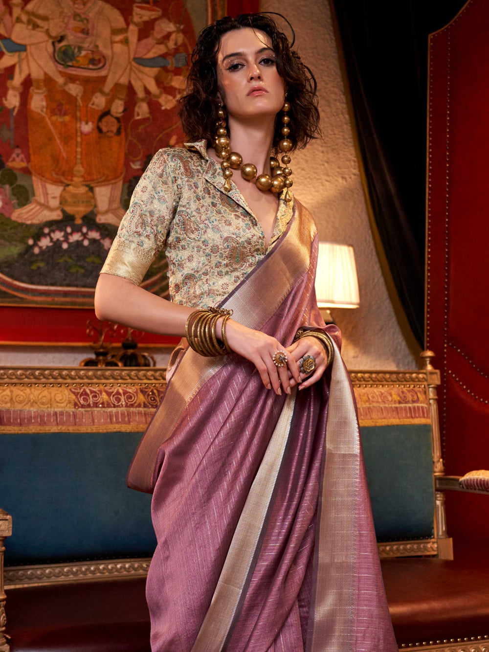 Soft Mauve chiffon saree with Champagne pallu and zari accents This image captures the side angle view showcasing blouse styling and zari border detail, ideal for visualizing festive elegance, designer appeal, and modern styling inspiration. Perfect for online shoppers seeking detailed previews before purchase, enhancing saree visual merchandising and SEO-rich product display strategy.                                                                                                                            