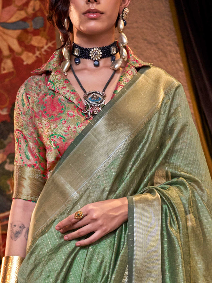 Soft Sage Green chiffon saree with Beige pallu and zari accents This image captures the zoomed texture view illustrating fabric weave and print clarity, ideal for visualizing festive elegance, designer appeal, and modern styling inspiration. Perfect for online shoppers seeking detailed previews before purchase, enhancing saree visual merchandising and SEO-rich product display strategy.                                                                                                                            