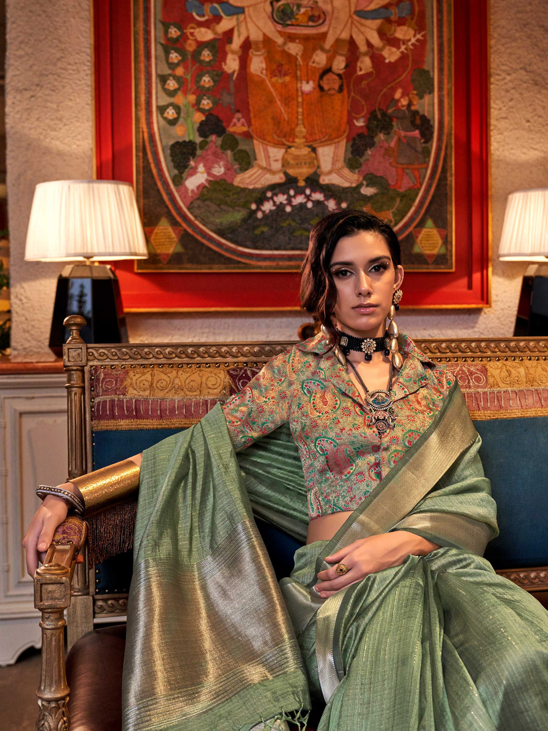 Soft Sage Green chiffon saree with Beige pallu and zari accents This image captures the model styling perspective with complete saree ensemble displayed, ideal for visualizing festive elegance, designer appeal, and modern styling inspiration. Perfect for online shoppers seeking detailed previews before purchase, enhancing saree visual merchandising and SEO-rich product display strategy.                                                                                                                           