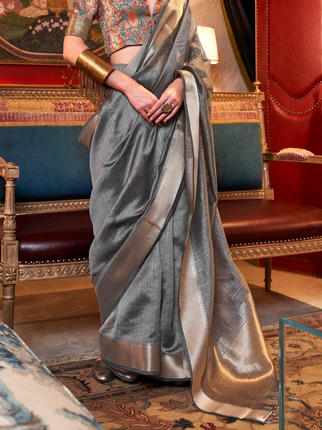 Soft Silver Grey chiffon saree with Platinum pallu and zari accents This image captures the back drape focus revealing pallu finesse and motif richness, ideal for visualizing festive elegance, designer appeal, and modern styling inspiration. Perfect for online shoppers seeking detailed previews before purchase, enhancing saree visual merchandising and SEO-rich product display strategy.                                                                                                                            