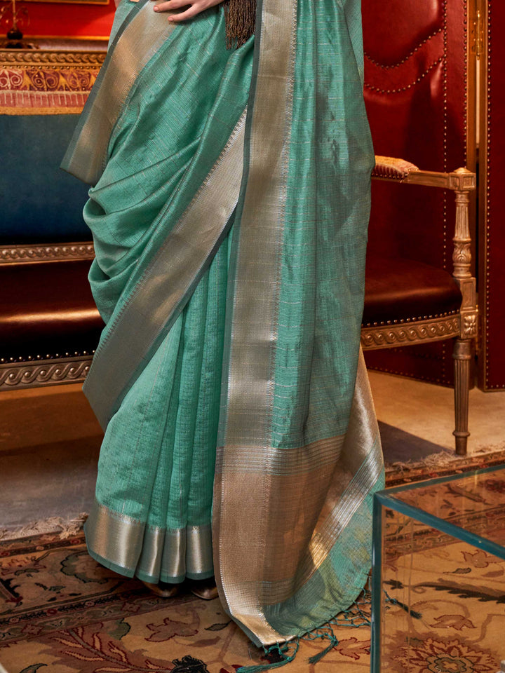 Soft Mint Green chiffon saree with Silver pallu and zari accents This image captures the back drape focus revealing pallu finesse and motif richness, ideal for visualizing festive elegance, designer appeal, and modern styling inspiration. Perfect for online shoppers seeking detailed previews before purchase, enhancing saree visual merchandising and SEO-rich product display strategy.                                                                                                                               