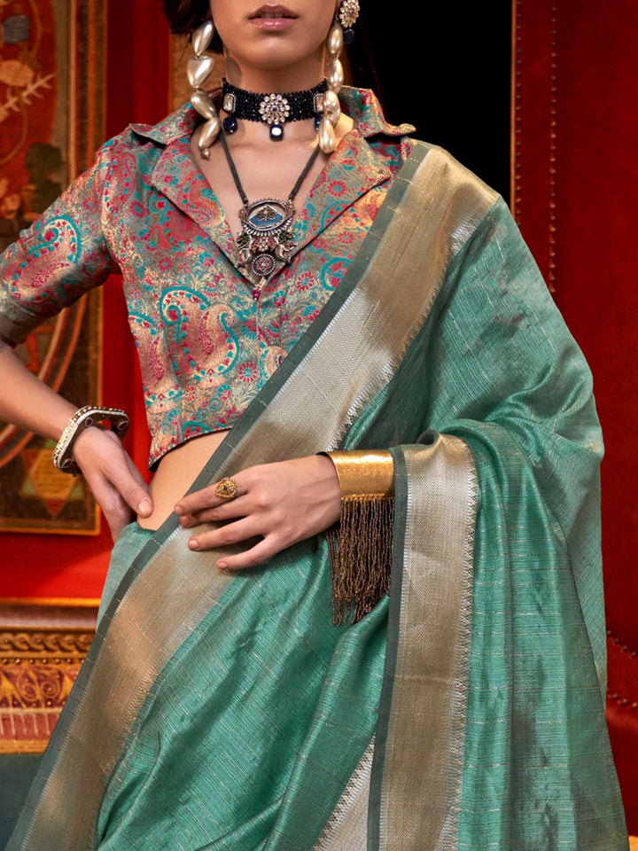 Soft Mint Green chiffon saree with Silver pallu and zari accents This image captures the zoomed texture view illustrating fabric weave and print clarity, ideal for visualizing festive elegance, designer appeal, and modern styling inspiration. Perfect for online shoppers seeking detailed previews before purchase, enhancing saree visual merchandising and SEO-rich product display strategy.                                                                                                                           