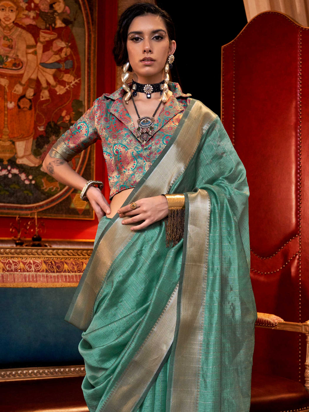 Soft Mint Green chiffon saree with Silver pallu and zari accents This image captures the side angle view showcasing blouse styling and zari border detail, ideal for visualizing festive elegance, designer appeal, and modern styling inspiration. Perfect for online shoppers seeking detailed previews before purchase, enhancing saree visual merchandising and SEO-rich product display strategy.                                                                                                                          