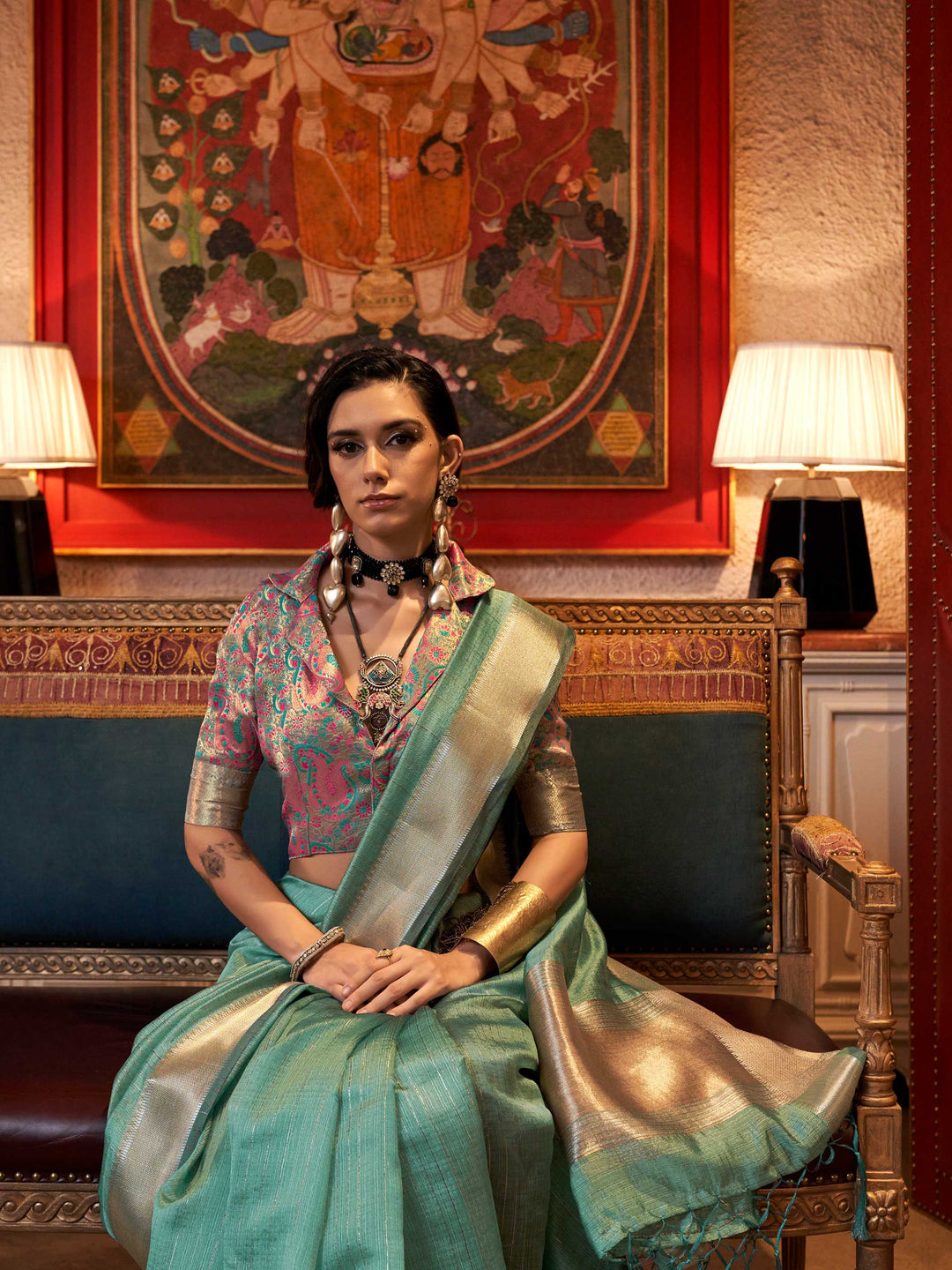 Soft Mint Green chiffon saree with Silver pallu and zari accents This image captures the model styling perspective with complete saree ensemble displayed, ideal for visualizing festive elegance, designer appeal, and modern styling inspiration. Perfect for online shoppers seeking detailed previews before purchase, enhancing saree visual merchandising and SEO-rich product display strategy.                                                                                                                          