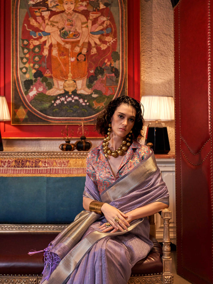 Soft Lavender chiffon saree with Ivory pallu and zari accents This image captures the model styling perspective with complete saree ensemble displayed, ideal for visualizing festive elegance, designer appeal, and modern styling inspiration. Perfect for online shoppers seeking detailed previews before purchase, enhancing saree visual merchandising and SEO-rich product display strategy.                                                                                                                             