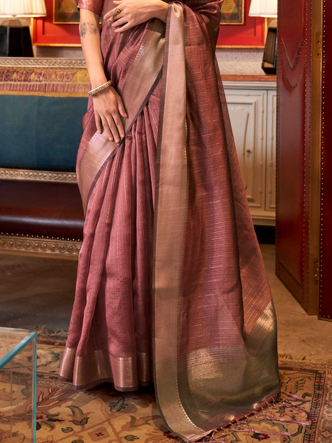 Soft Dusty Rose chiffon saree with Taupe pallu and zari accents This image captures the back drape focus revealing pallu finesse and motif richness, ideal for visualizing festive elegance, designer appeal, and modern styling inspiration. Perfect for online shoppers seeking detailed previews before purchase, enhancing saree visual merchandising and SEO-rich product display strategy.                                                                                                                                