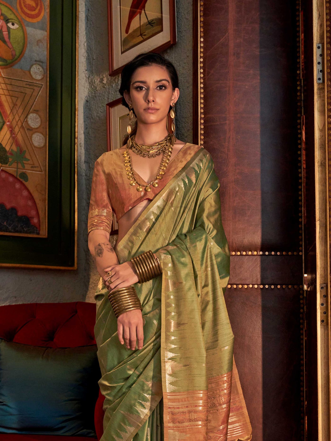 Olive Green–Dusky Rose feathersoft raw silk saree featuring banarasi ikat design, ideal for sangeet night and festive evening wear with rich texture and contrast blouse. Olive Green–Dusky Rose feathersoft raw silk saree featuring banarasi ikat design, ideal for sangeet night and festive evening wear with rich texture and contrast blouse..