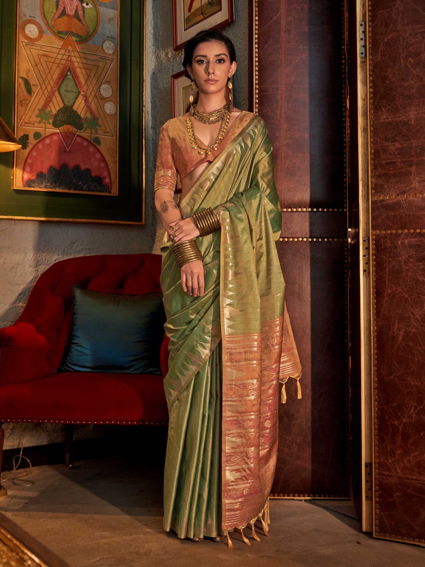Olive Green–Dusky Rose feathersoft raw silk saree featuring banarasi ikat design, ideal for sangeet night and festive evening wear with rich texture and contrast blouse. Olive Green–Dusky Rose feathersoft raw silk saree featuring banarasi ikat design, ideal for sangeet night and festive evening wear with rich texture and contrast blouse..