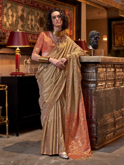Beige Gold–Rust Copper feathersoft raw silk saree featuring banarasi ikat design, ideal for sangeet night and festive evening wear with rich texture and contrast blouse. Beige Gold–Rust Copper feathersoft raw silk saree featuring banarasi ikat design, ideal for sangeet night and festive evening wear with rich texture and contrast blouse..
