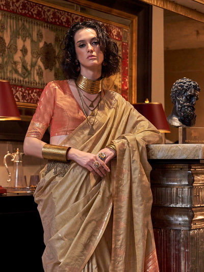 Beige Gold–Rust Copper feathersoft raw silk saree featuring banarasi ikat design, ideal for sangeet night and festive evening wear with rich texture and contrast blouse. Beige Gold–Rust Copper feathersoft raw silk saree featuring banarasi ikat design, ideal for sangeet night and festive evening wear with rich texture and contrast blouse..