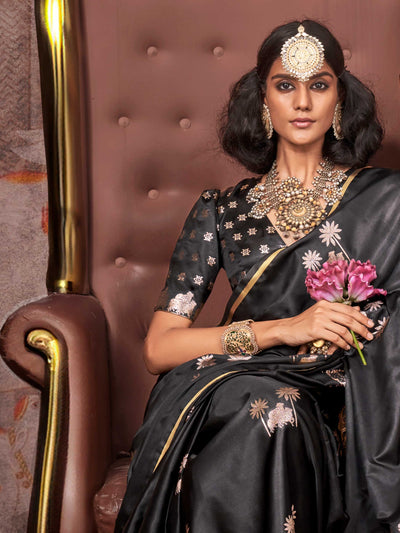 Black–Rose Gold satin silk saree with jacquard woven motifs and floral zari detailing. Perfect partywear or reception look with embroidered blouse and traditional drape, ideal for festive fashion styling.