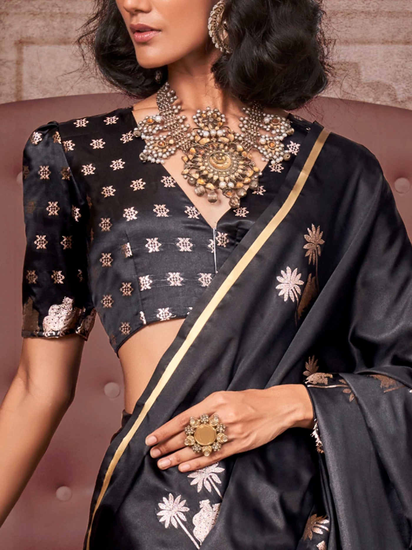 Black–Rose Gold satin silk saree with jacquard woven motifs and floral zari detailing. Perfect partywear or reception look with embroidered blouse and traditional drape, ideal for festive fashion styling. Black–Rose Gold satin silk saree with jacquard woven motifs and floral zari detailing. Perfect partywear or reception look with embroidered blouse and traditional drape, ideal for festive fashion styling..
