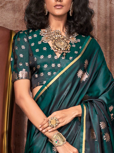 Bottle Green–Rose Gold satin silk saree with jacquard woven motifs and floral zari detailing. Perfect partywear or reception look with embroidered blouse and traditional drape, ideal for festive fashion styling. Bottle Green–Rose Gold satin silk saree with jacquard woven motifs and floral zari detailing. Perfect partywear or reception look with embroidered blouse and traditional drape, ideal for festive fashion styling..
