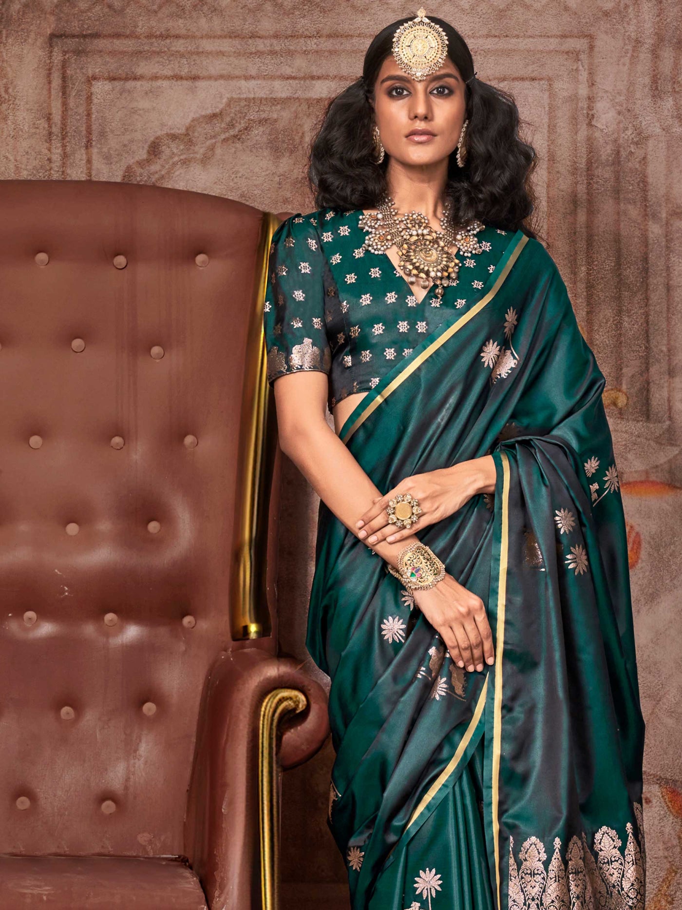 Bottle Green–Rose Gold satin silk saree with jacquard woven motifs and floral zari detailing. Perfect partywear or reception look with embroidered blouse and traditional drape, ideal for festive fashion styling. Bottle Green–Rose Gold satin silk saree with jacquard woven motifs and floral zari detailing. Perfect partywear or reception look with embroidered blouse and traditional drape, ideal for festive fashion styling..