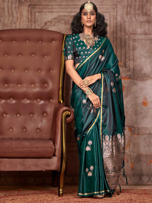 Bottle Green–Rose Gold satin silk saree with jacquard woven motifs and floral zari detailing. Perfect partywear or reception look with embroidered blouse and traditional drape, ideal for festive fashion styling. Bottle Green–Rose Gold satin silk saree with jacquard woven motifs and floral zari detailing. Perfect partywear or reception look with embroidered blouse and traditional drape, ideal for festive fashion styling..