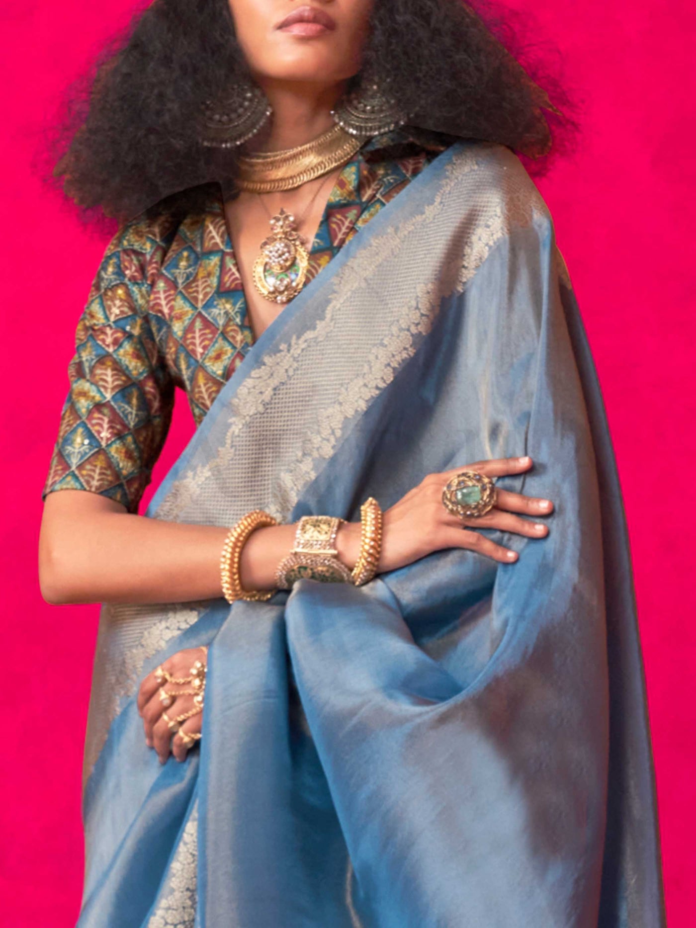 Stone Blue–Silver Zari tissue viscose silk saree with jacquard woven zari work, ideal for weddings, bridesmaids, and elegant evening events. Features tassel border and shimmering finish. Stone Blue–Silver Zari tissue viscose silk saree with jacquard woven zari work, ideal for weddings, bridesmaids, and elegant evening events. Features tassel border and shimmering finish..