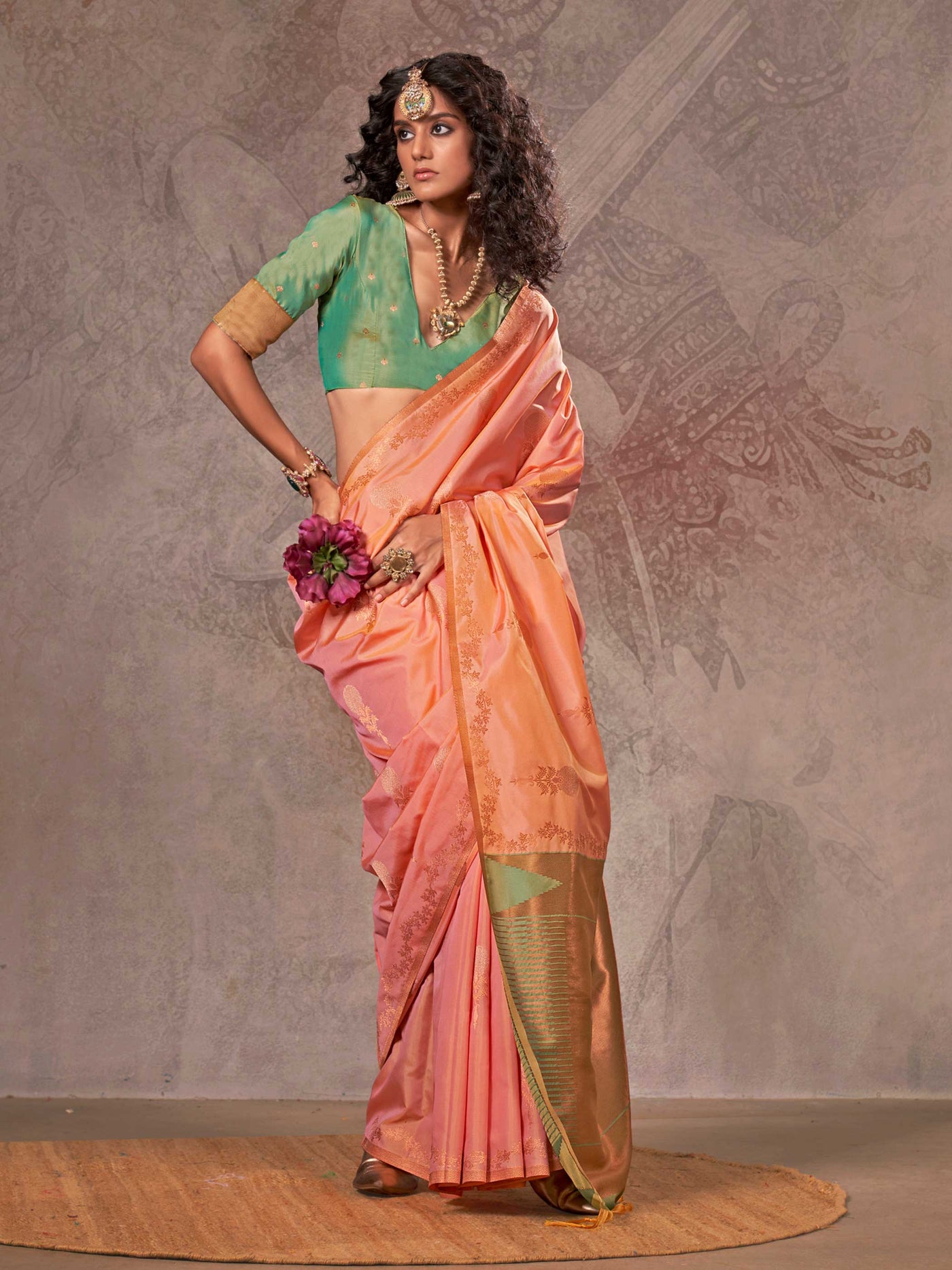 Peach Coral–Gold Green two-tone satin silk saree with woven zari work, styled for bridal wedding ceremonies with jacquard pattern and contrast pallu elegance. Peach Coral–Gold Green two-tone satin silk saree with woven zari work, styled for bridal wedding ceremonies with jacquard pattern and contrast pallu elegance..
