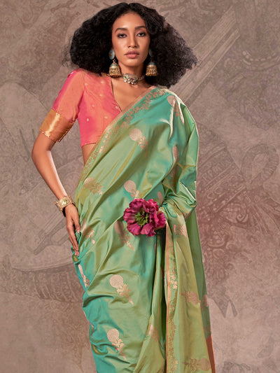 Mint Green–Rose Peach two-tone satin silk saree with woven zari work, styled for bridal wedding ceremonies with jacquard pattern and contrast pallu elegance. Mint Green–Rose Peach two-tone satin silk saree with woven zari work, styled for bridal wedding ceremonies with jacquard pattern and contrast pallu elegance..