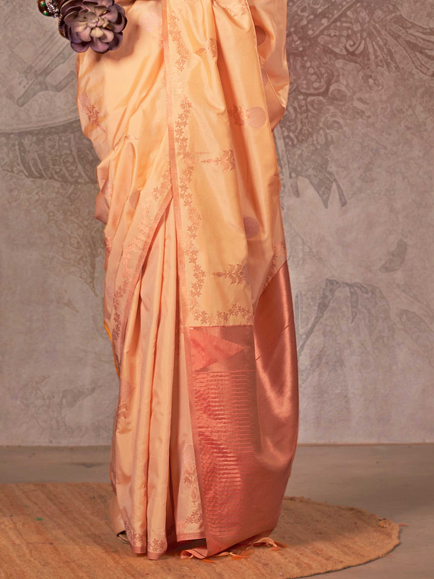 Buttermilk Yellow–Warm Peach two-tone satin silk saree with woven zari work, styled for bridal wedding ceremonies with jacquard pattern and contrast pallu elegance. Buttermilk Yellow–Warm Peach two-tone satin silk saree with woven zari work, styled for bridal wedding ceremonies with jacquard pattern and contrast pallu elegance..