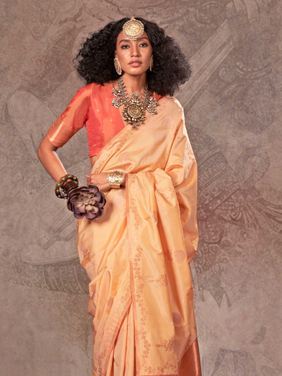 Buttermilk Yellow–Warm Peach two-tone satin silk saree with woven zari work, styled for bridal wedding ceremonies with jacquard pattern and contrast pallu elegance. Buttermilk Yellow–Warm Peach two-tone satin silk saree with woven zari work, styled for bridal wedding ceremonies with jacquard pattern and contrast pallu elegance..
