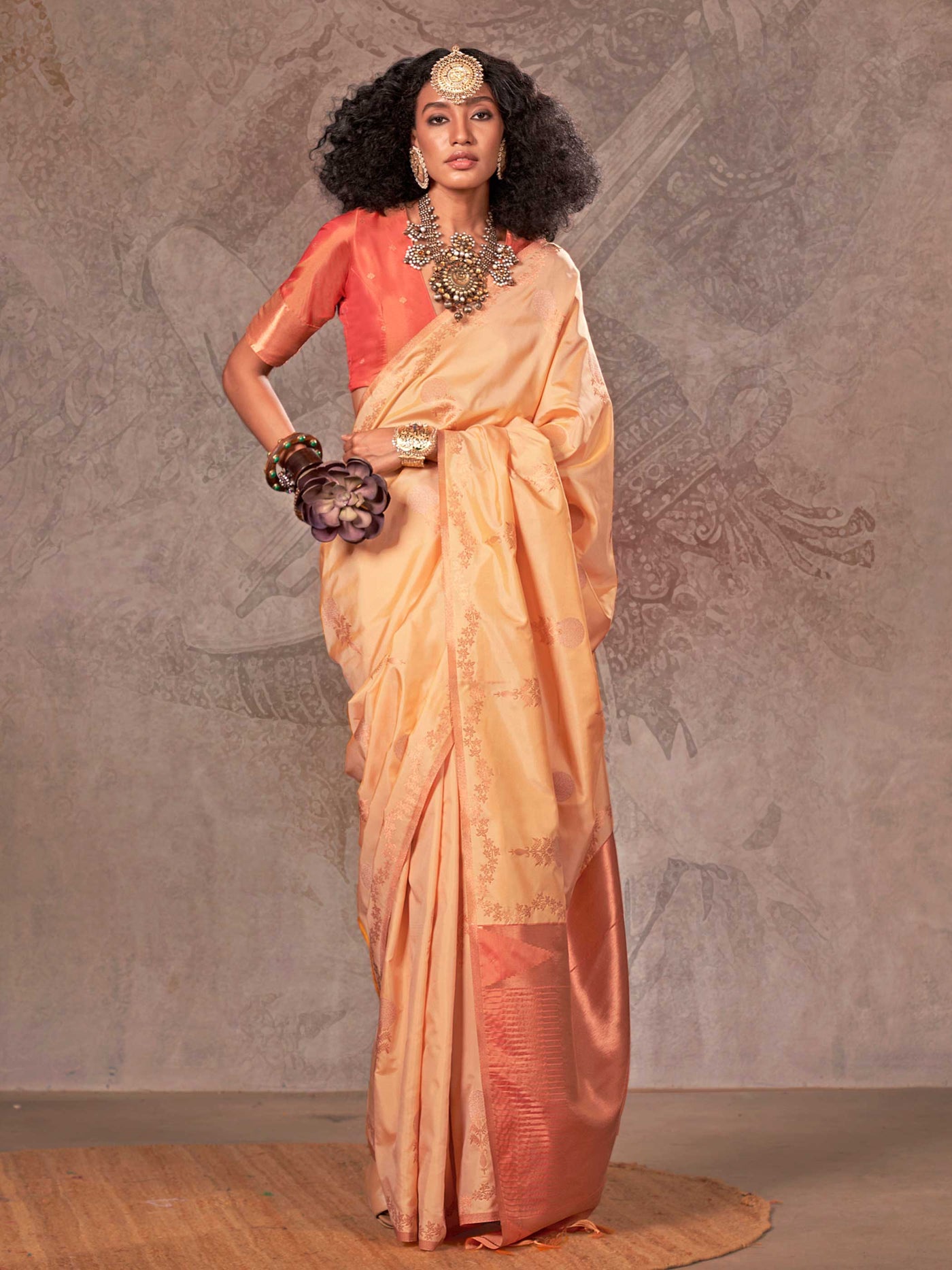 Buttermilk Yellow–Warm Peach two-tone satin silk saree with woven zari work, styled for bridal wedding ceremonies with jacquard pattern and contrast pallu elegance. Buttermilk Yellow–Warm Peach two-tone satin silk saree with woven zari work, styled for bridal wedding ceremonies with jacquard pattern and contrast pallu elegance..