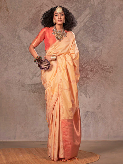 Buttermilk Yellow–Warm Peach two-tone satin silk saree with woven zari work, styled for bridal wedding ceremonies with jacquard pattern and contrast pallu elegance. Buttermilk Yellow–Warm Peach two-tone satin silk saree with woven zari work, styled for bridal wedding ceremonies with jacquard pattern and contrast pallu elegance..
