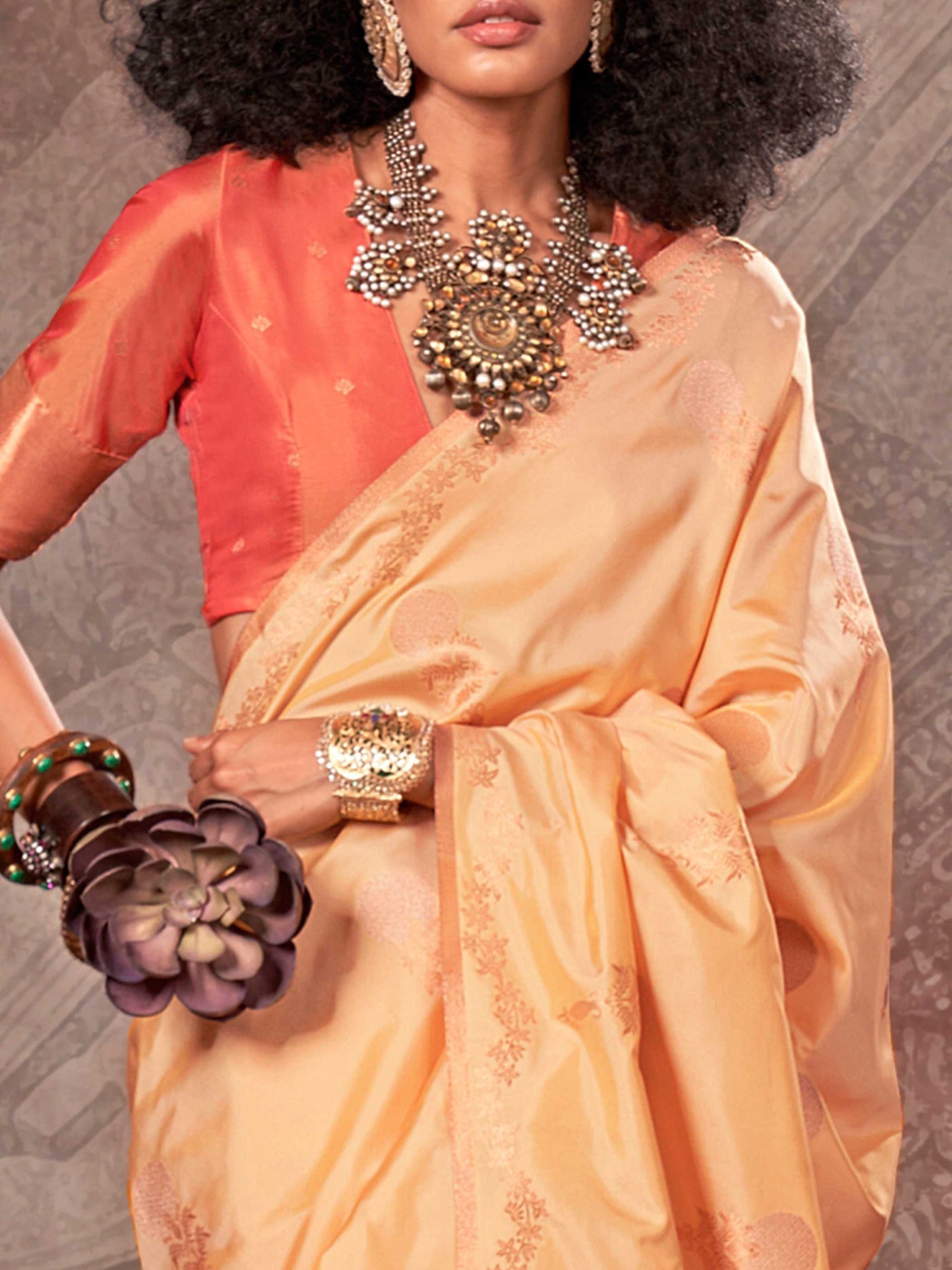 Buttermilk Yellow–Warm Peach two-tone satin silk saree with woven zari work, styled for bridal wedding ceremonies with jacquard pattern and contrast pallu elegance. Buttermilk Yellow–Warm Peach two-tone satin silk saree with woven zari work, styled for bridal wedding ceremonies with jacquard pattern and contrast pallu elegance..
