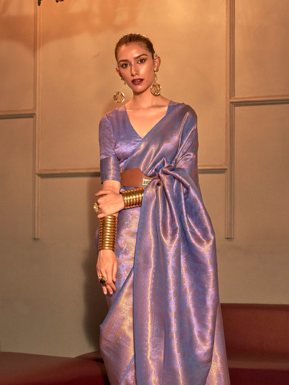 Elegant pastel kanjivaram silk saree in lilac-lavender tones with jacquard detailing. Soft silk saree in lavender hues with delicate silver zari and traditional weave motifs.