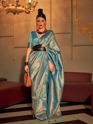 Aqua Blue–Turquoise kanjivaram silk saree with subtle dual-tone effect and intricate zari border. Aqua Blue–Turquoise wedding saree crafted from pastel silk and jacquard floral weaving.