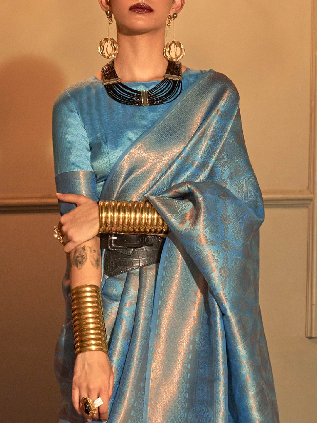 Icy Blue–Silver woven zari silk saree in a dual-tone palette for haldi, reception or sangeet. Glossy soft-touch silk saree in Icy Blue–Silver, designed for wedding celebrations and light events.