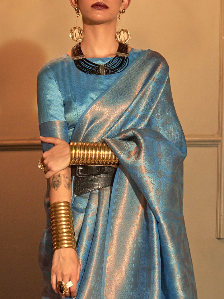 Icy Blue–Silver woven zari silk saree in a dual-tone palette for haldi, reception or sangeet. Glossy soft-touch silk saree in Icy Blue–Silver, designed for wedding celebrations and light events.
