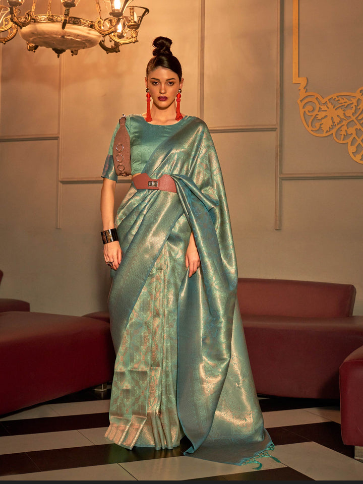 Mint Green–Sea Blue kanjivaram silk saree with subtle dual-tone effect and intricate zari border. Mint Green–Sea Blue wedding saree crafted from pastel silk and jacquard floral weaving.