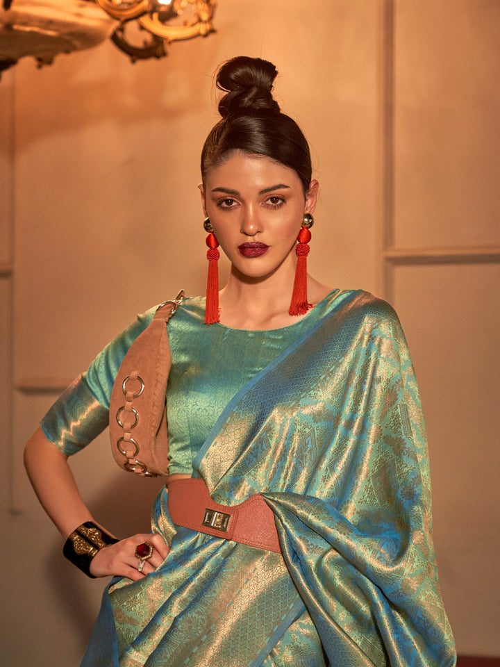 Mint Green–Sea Blue woven zari silk saree in a dual-tone palette for haldi, reception or sangeet. Glossy soft-touch silk saree in Mint Green–Sea Blue, designed for wedding celebrations and light events.