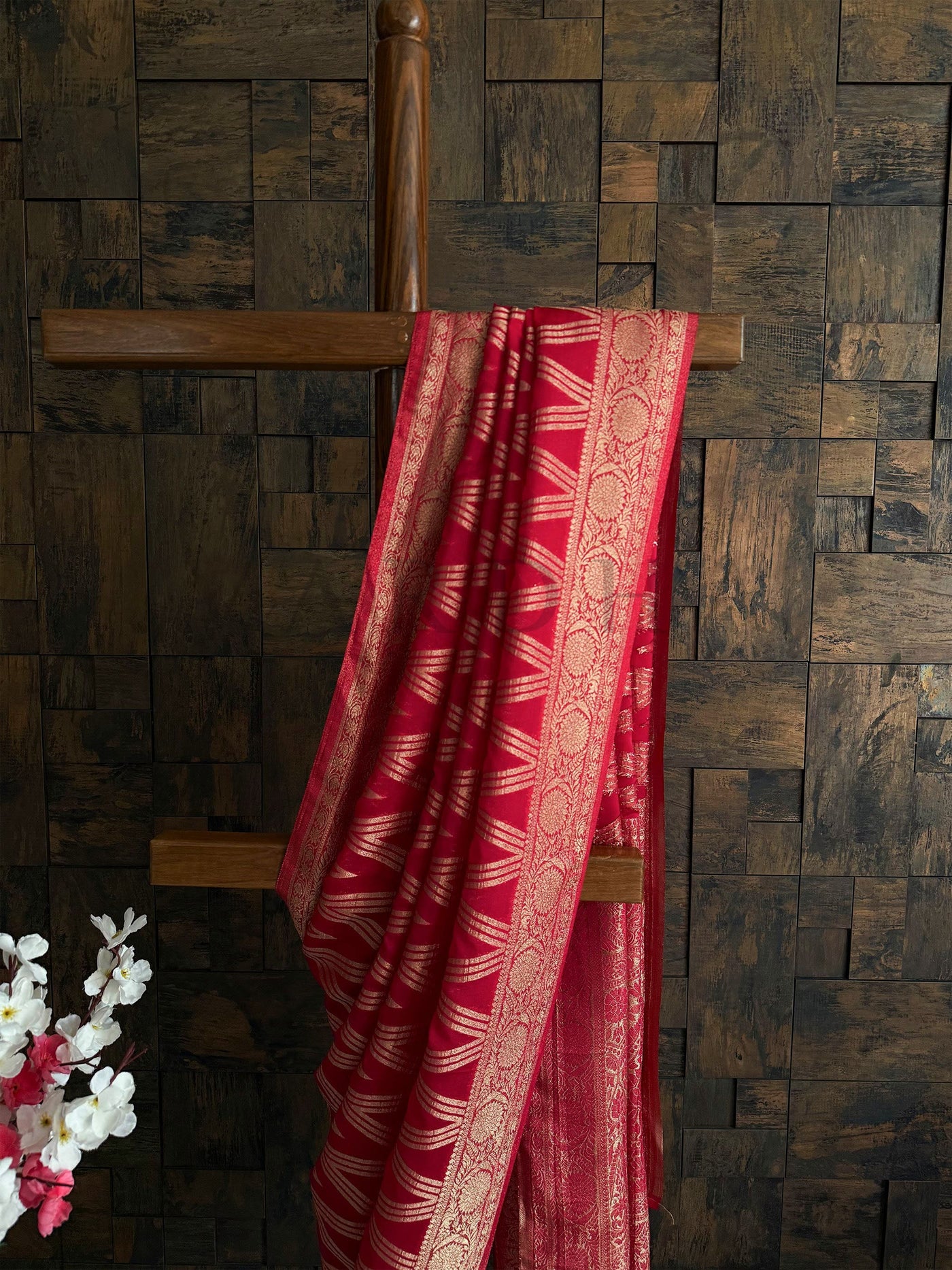 Traditional festive saree in red with classic zari work and unstitched blouse