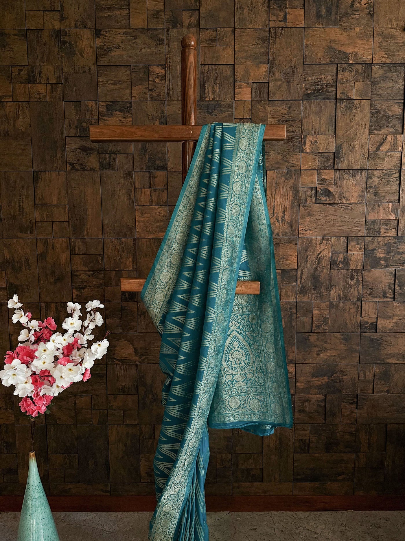 Elegant teal saree for sangeet with soft flow and gold border