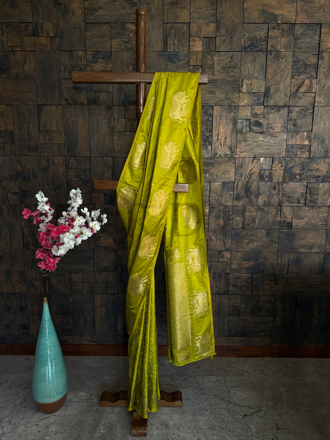 Leaf green satin saree with antique gold zari elephant woven motifs