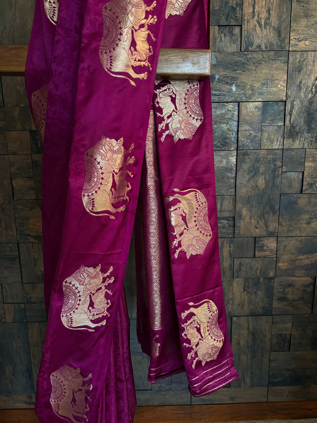 Soft satin saree in royal tone with traditional elephant motifs