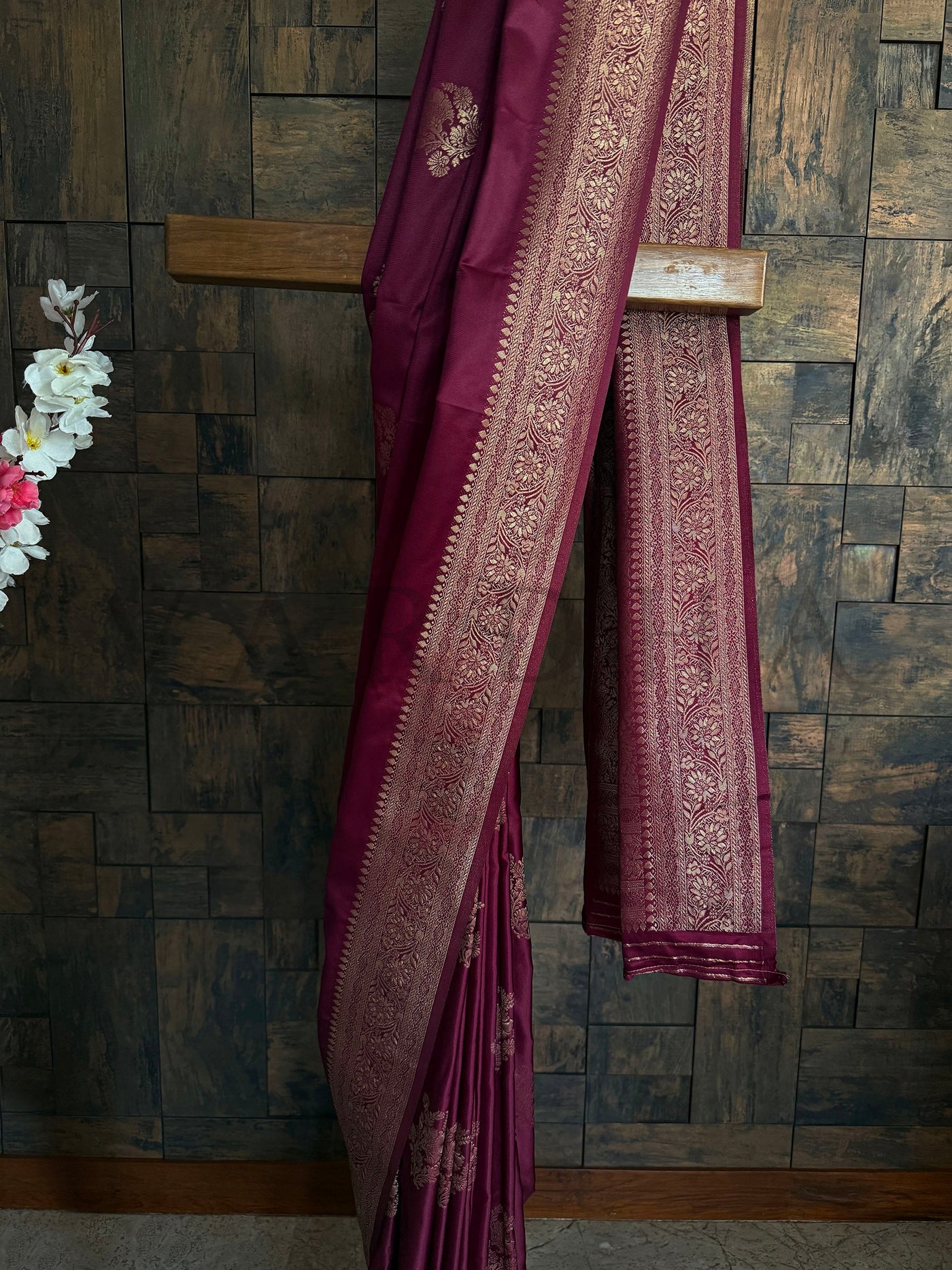Glossy maroon saree ideal for rituals and engagement ceremonies