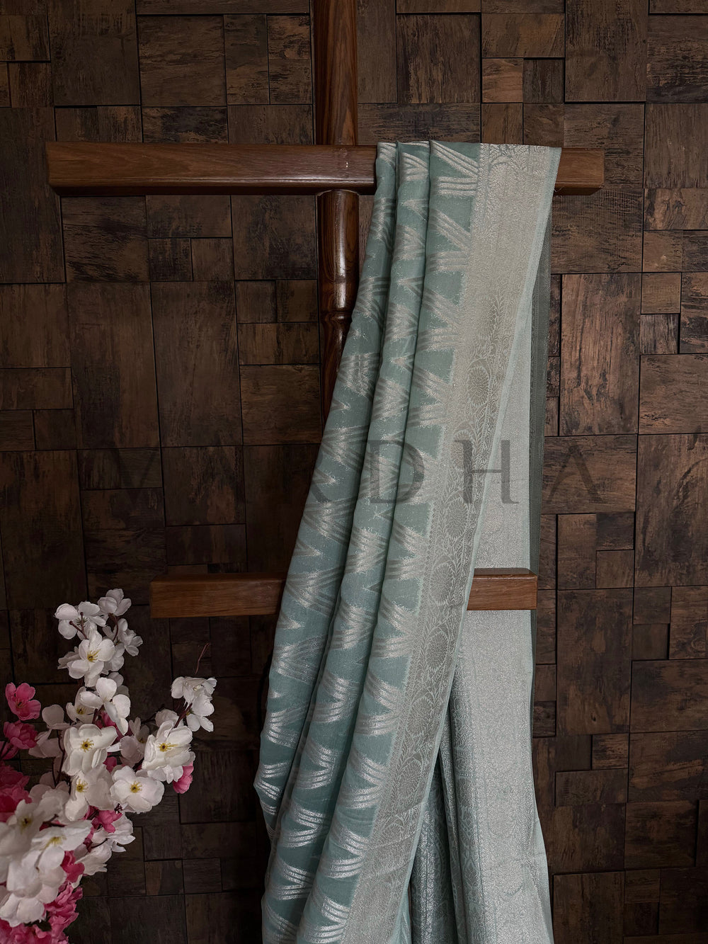 Close-up of embroidery on turquoise georgette fabric