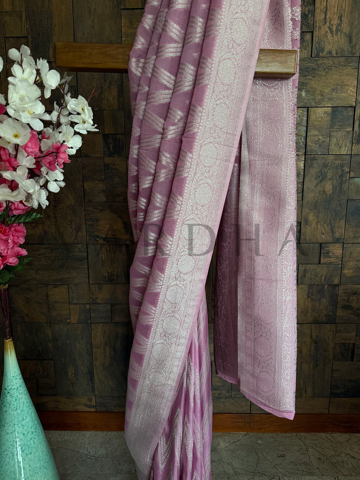 Close-up of feather-soft fabric texture in blush pink

