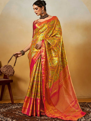 Yellow–Pink Banarasi satin silk saree with zari work and woven parrot motifs, styled for traditional Indian wedding rituals with luxury finish. Yellow–Pink Banarasi satin silk saree with zari work and woven parrot motifs, styled for traditional Indian wedding rituals with luxury finish..