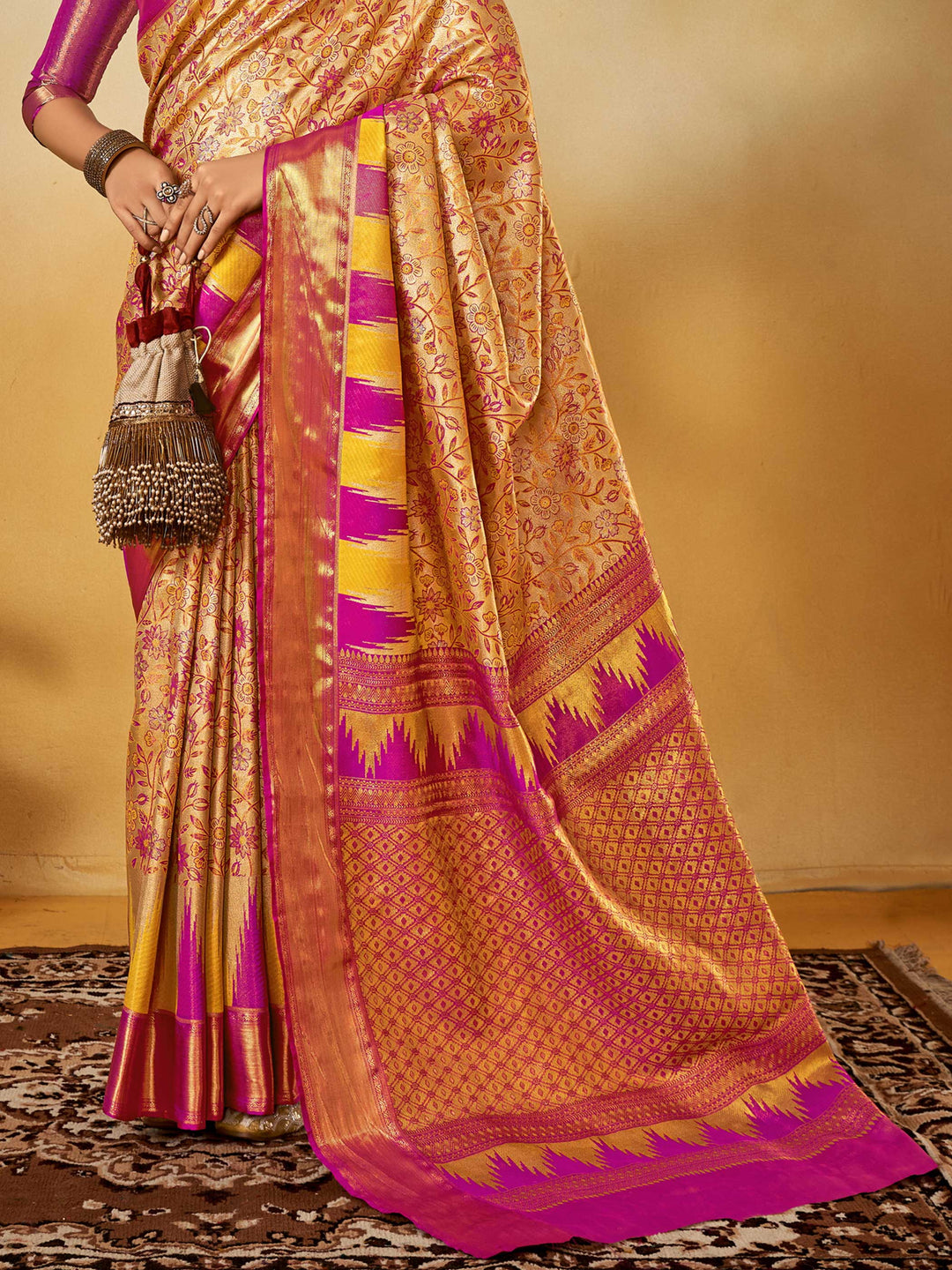 Beige–Magenta Banarasi satin silk saree with zari work and woven parrot motifs, styled for traditional Indian wedding rituals with luxury finish. Beige–Magenta Banarasi satin silk saree with zari work and woven parrot motifs, styled for traditional Indian wedding rituals with luxury finish..