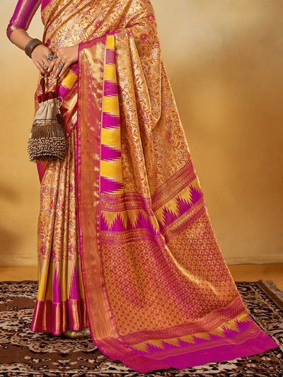 Beige–Magenta Banarasi satin silk saree with zari work and woven parrot motifs, styled for traditional Indian wedding rituals with luxury finish. Beige–Magenta Banarasi satin silk saree with zari work and woven parrot motifs, styled for traditional Indian wedding rituals with luxury finish..