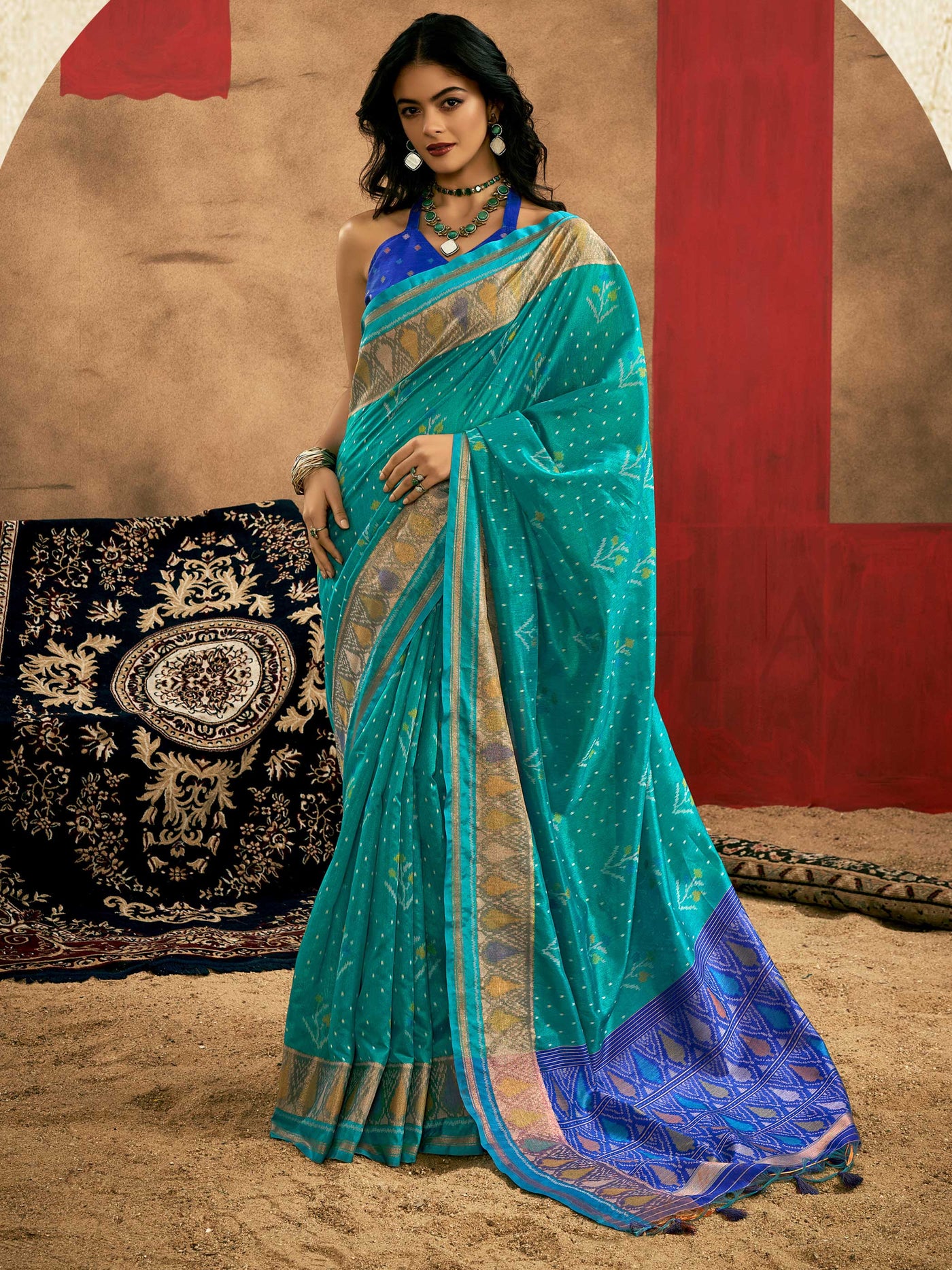 Teal Blue–Royal Blue Banarasi silk saree with Patola-inspired design and rich zari border, styled for wedding glamour and traditional elegance. Teal Blue–Royal Blue Banarasi silk saree with Patola-inspired design and rich zari border, styled for wedding glamour and traditional elegance..