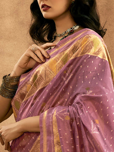 Lavender Mauve–Gold Banarasi silk saree with Patola-inspired design and rich zari border, styled for wedding glamour and traditional elegance. Lavender Mauve–Gold Banarasi silk saree with Patola-inspired design and rich zari border, styled for wedding glamour and traditional elegance..