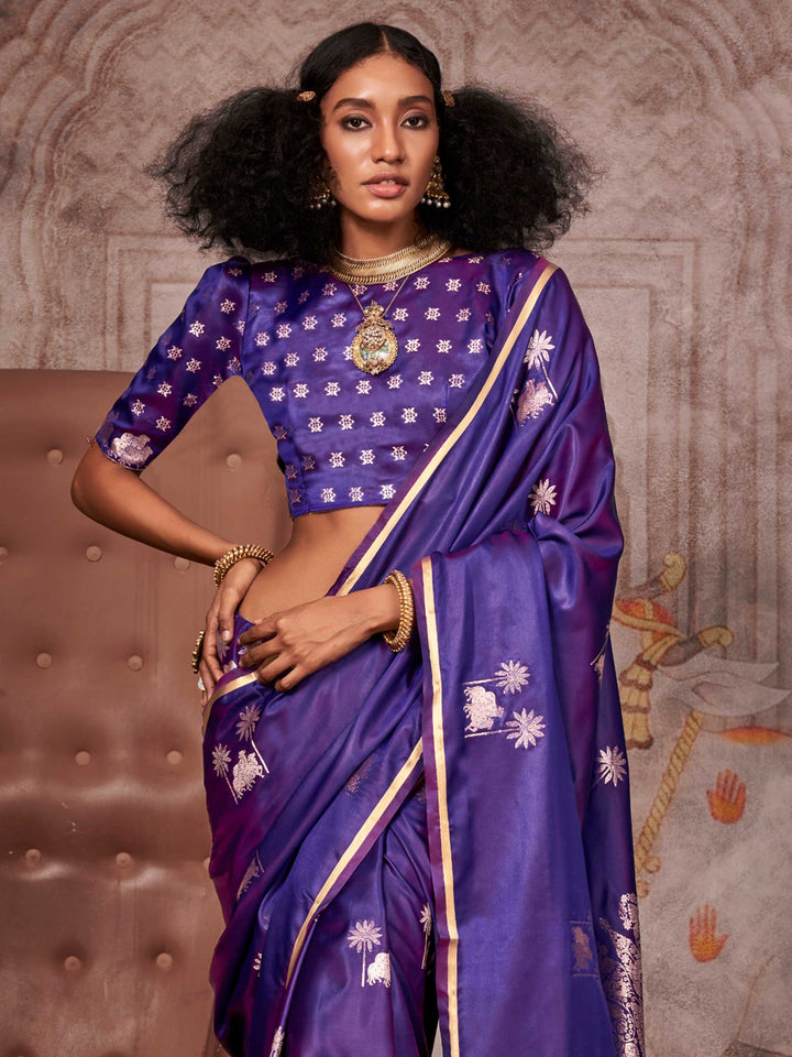 Luxury Aubergine Purple Banarasi Saree with Exquisite Floral Zari Motifs, offering a Lustrous Satin Silk Drape for Bridal & Ethnic Fashion Enthusiasts.
