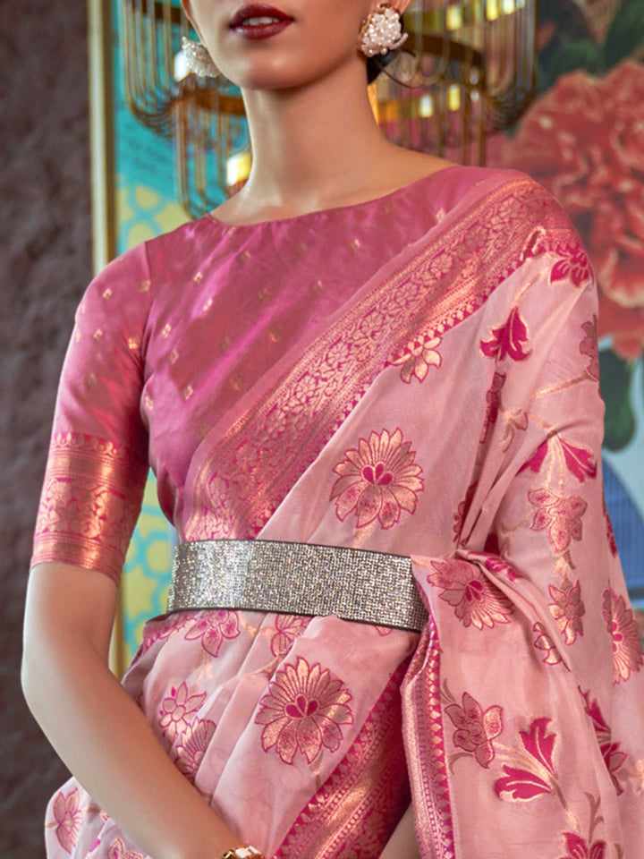 Luxurious Baby Pink Shimmer Organza Saree enriched with Copper Zari Weaving and a Contrast Border, ensuring a Graceful Drape—suitable for Traditional Functions and Modern Festivities. 
