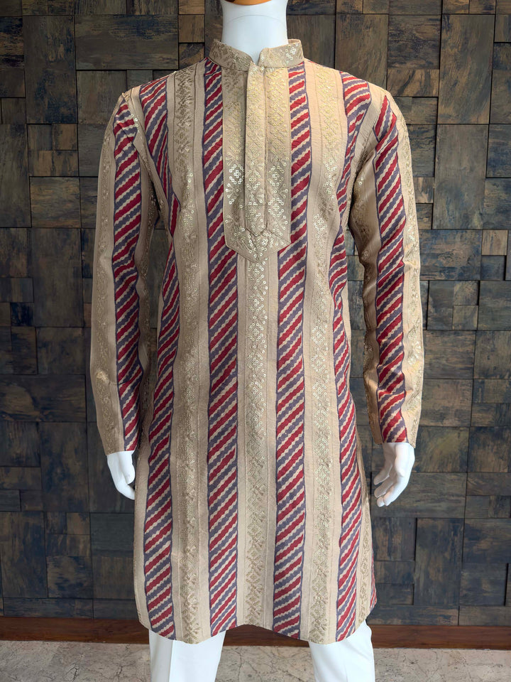 Traditional kurta with red and beige stripes on a mannequin against a wooden paneled wall. Texture shot of Viscose fabric with Diagonal Print and Thread Embroidery.